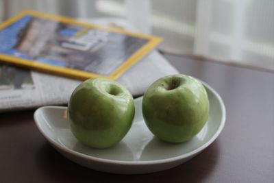 Close-up of fruits in plate on table