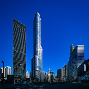 Modern buildings in city against clear blue sky