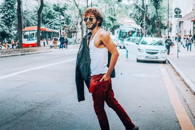 Full length of boy standing on city street