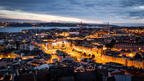 High angle view of illuminated cityscape against sky