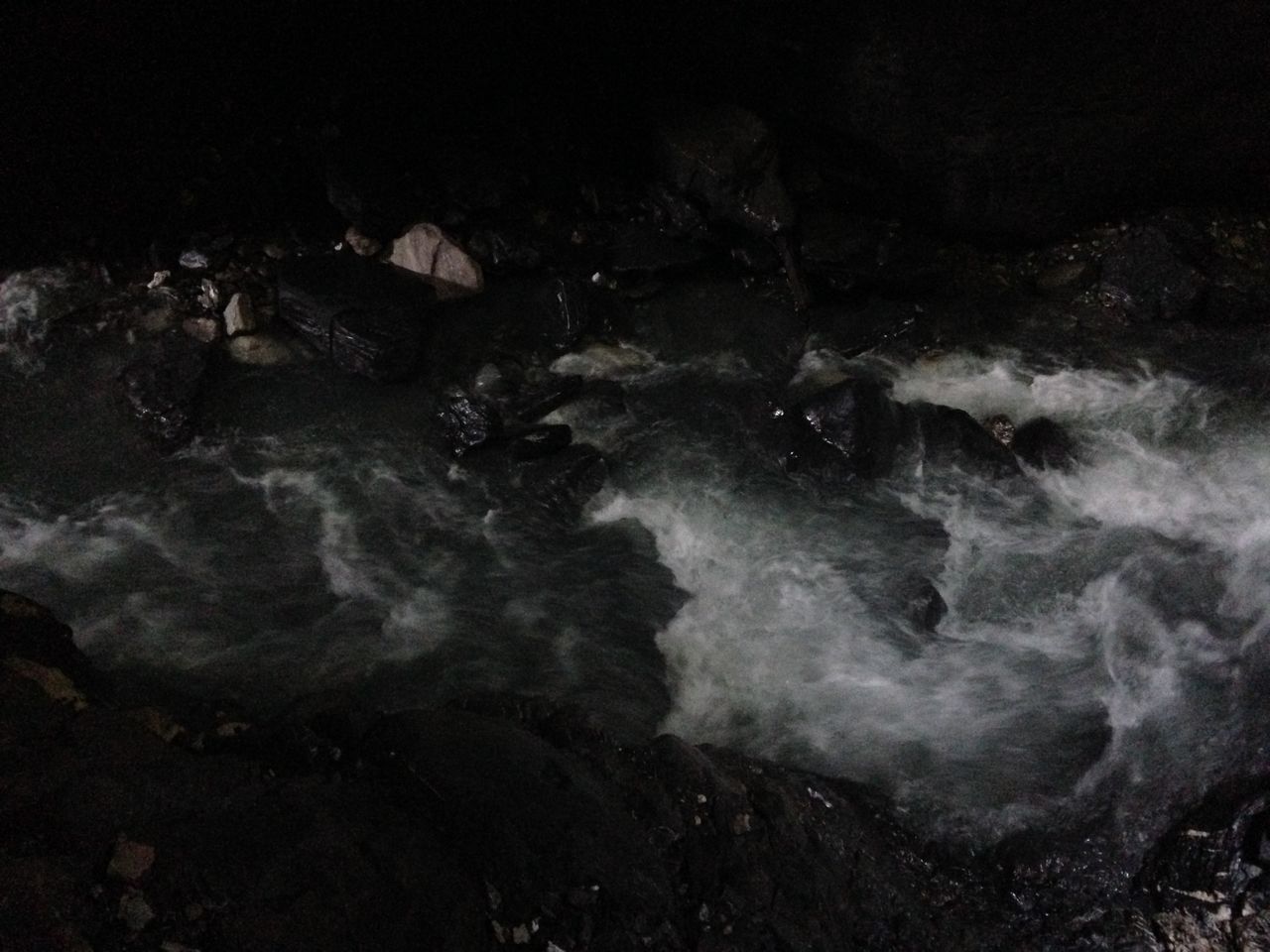 water, sea, rock - object, high angle view, surf, nature, wave, motion, beauty in nature, power in nature, shore, scenics, outdoors, no people, rock, waterfront, beach, tranquility, night, rock formation