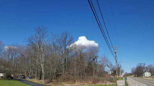 Low angle view of road against blue sky