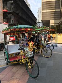 Bicycles parked on street against buildings