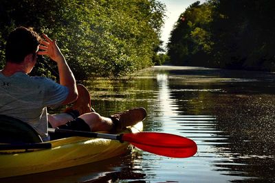 People sitting on boat in river