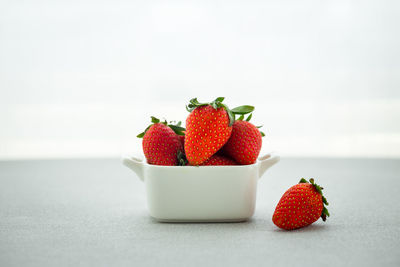 Close-up of strawberries in bowl on table