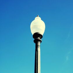 Low angle view of street light against clear blue sky