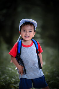 Portrait of boy standing outdoors