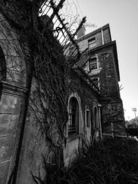 Low angle view of old building against sky