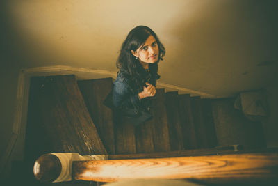 Young woman walking down stairs