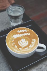 Close-up of cappuccino on table