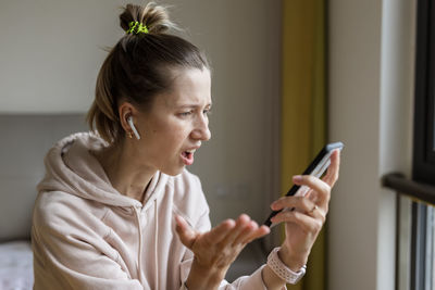 Young woman using mobile phone