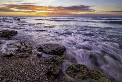 Scenic view of sea against sky during sunset