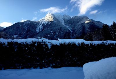 Scenic view of snowcapped mountains during winter