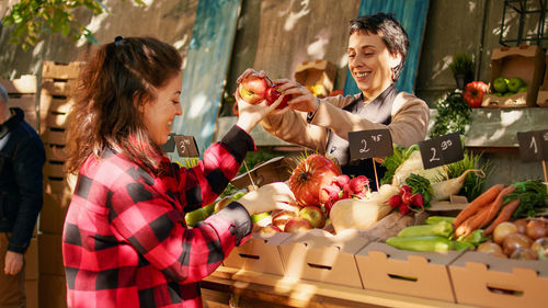 Portrait of woman holding food at home