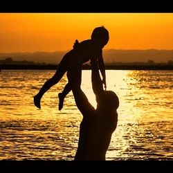 Silhouette of people at sunset