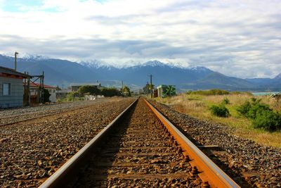 Railroad track with mountain in background