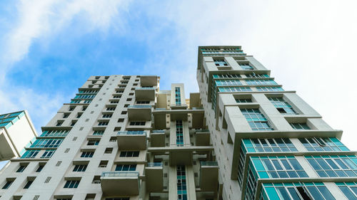 Low angle view of modern buildings against sky