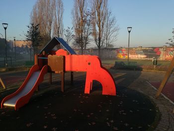 Lifeguard hut in park against sky during sunset