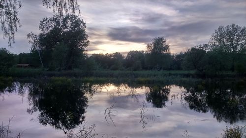 Scenic view of lake at sunset