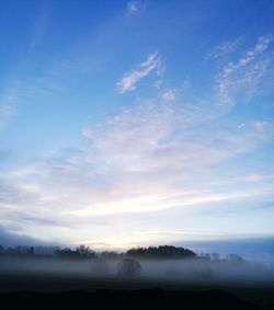 Scenic view of landscape against sky during sunset