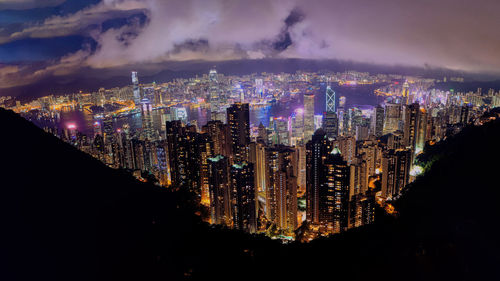 High angle view of illuminated buildings in city at night