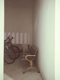 Bicycle parked against wall at home