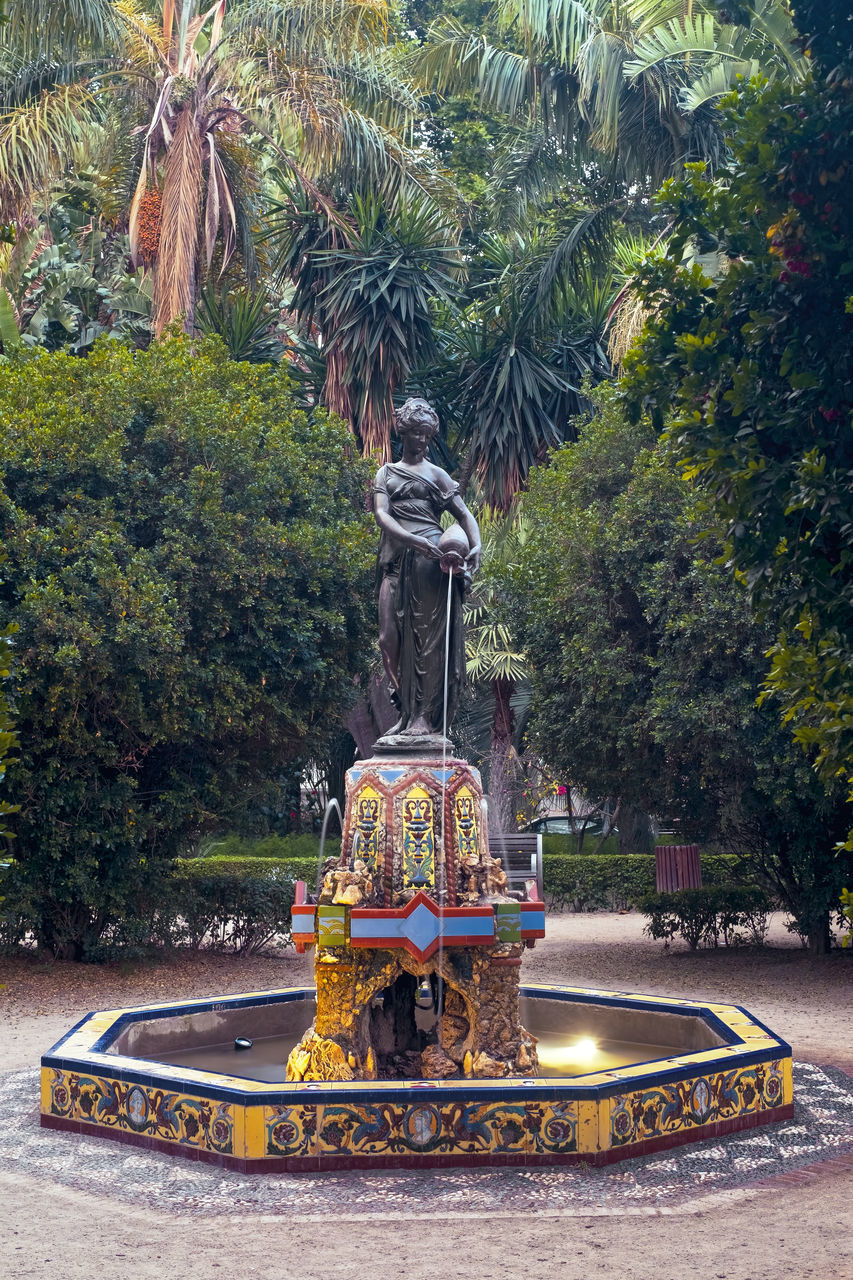 STATUE IN PARK BY TREES