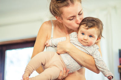 Portrait of cute baby girl at home