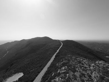 Scenic view of mountain road against sky