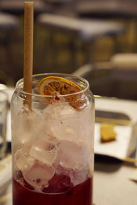 Libbey raspberry juice glass filled with ice and dried lemon slice