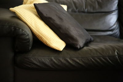 Close up of pillows on sofa at home