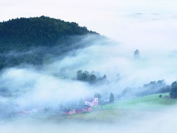 Heavy mist in landscape. magnificent autumn creamy fog in countryside. 