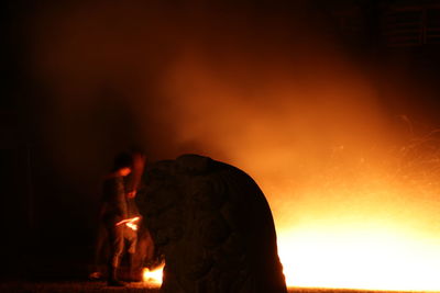 Close-up of fire burning at night