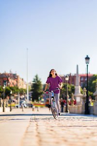 Side view of woman walking on street