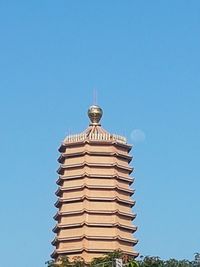 Low angle view of building against blue sky