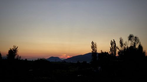 Scenic view of silhouette landscape against sky during sunset