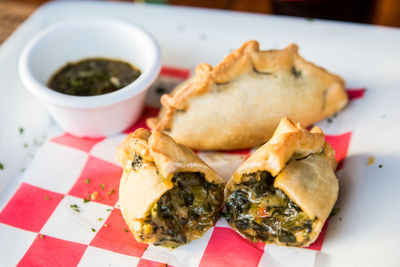 Close-up of stuffed food and dip in tray