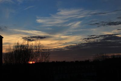 Silhouette landscape against sky during sunset