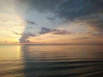 Scenic view of sea against sky at sunset