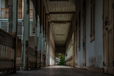 Empty alley amidst buildings in city