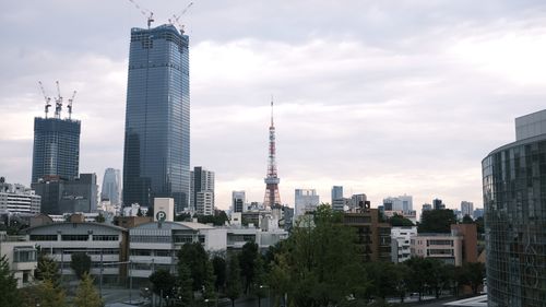 Modern buildings in city against sky