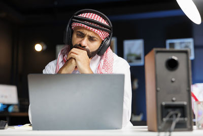 Young woman using laptop on table