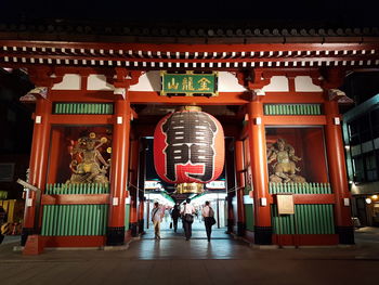 Group of people in temple outside building