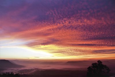 Scenic view of silhouette landscape against sky during sunset