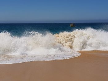 Scenic view of sea against clear sky