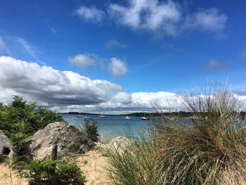 Scenic view of sea against cloudy sky