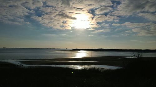 Scenic view of sea at sunset