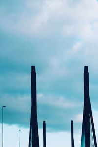 Low angle view of smoke stack against sky