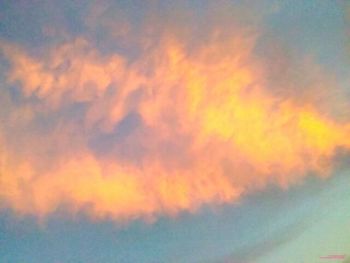 Low angle view of cloudy sky at sunset