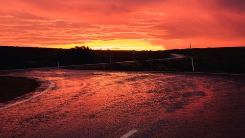 Scenic view of silhouette land against sky during sunset